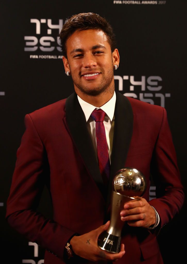 ฟุตบอลไทย pantip Neymar poses with his award after being included in the team of the...